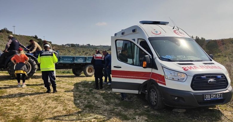 Tarlada devrilen traktörün üzerinden savrulan çiftçi yaralandı