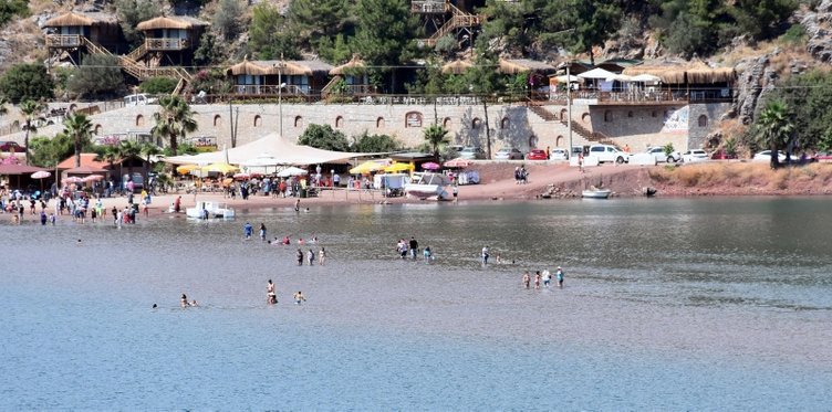 Muğla’nın Marmaris ilçesindeki Kızkumu Plajı’na turist yağıyor! Kızkumu efsanesi nedir? İşte detaylar...