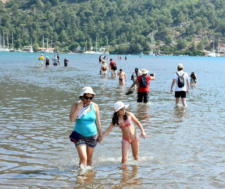 Muğla’nın Marmaris ilçesindeki Kızkumu Plajı’na turist yağıyor! Kızkumu efsanesi nedir? İşte detaylar...