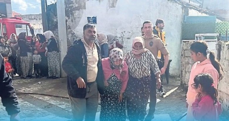 Alevlerin ortasında kalan kadını komşuları kurtardı
